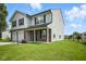 Attractive two-story home with brick and vinyl siding, attached garage, and a freshly cut lawn at 7549 Stockard St, Indianapolis, IN 46239