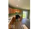 Efficient kitchen featuring wooden cabinets, modern appliances, and a bright eating area at 7549 Stockard St, Indianapolis, IN 46239