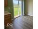 View of the sliding glass doors from the kitchen, overlooking the backyard at 7549 Stockard St, Indianapolis, IN 46239
