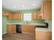 Functional kitchen with light wood cabinets and modern appliances, offering a practical cooking space at 7549 Stockard St, Indianapolis, IN 46239