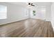 Spacious living room with sleek flooring, offering ample space for entertaining at 7549 Stockard St, Indianapolis, IN 46239