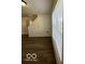 Bright living room featuring wood-look floors, windows, and stairs at 7549 Stockard St, Indianapolis, IN 46239