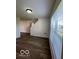 Bright living room featuring sleek floors and large windows bringing in natural light at 7549 Stockard St, Indianapolis, IN 46239