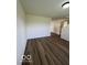 Neutral living room with wood-look floors and ample space at 7549 Stockard St, Indianapolis, IN 46239