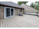 Spacious outdoor deck area with sliding glass doors, offering a great space for entertaining and relaxation at 7940 Benjamin Dr, Lawrence, IN 46226