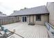 Large backyard deck with a sliding glass door, perfect for outdoor dining and relaxation at 7940 Benjamin Dr, Lawrence, IN 46226