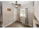 Cozy dining area with a ceiling fan and a window that provides natural light at 7940 Benjamin Dr, Lawrence, IN 46226