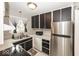 Efficient kitchen featuring stainless steel appliances and ample cabinet space for storage solutions at 7940 Benjamin Dr, Lawrence, IN 46226