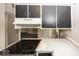 Efficient kitchen layout with countertops and cabinets, offering practicality and room for meal preparation at 7940 Benjamin Dr, Lawrence, IN 46226