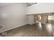Open concept living room featuring laminate floors, high ceilings and natural light at 7940 Benjamin Dr, Lawrence, IN 46226