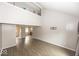 Spacious living area with soaring ceilings, wood floors, and lots of natural light at 7940 Benjamin Dr, Lawrence, IN 46226