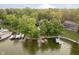 Waterfront home with lush landscaping and a private boat dock on a scenic lake at 8301 Reef Ct, Indianapolis, IN 46236