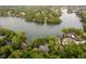 Scenic aerial view showcases waterfront property with lush trees at 8301 Reef Ct, Indianapolis, IN 46236