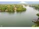 Expansive lake view with surrounding lush greenery, highlighting waterfront property at 8301 Reef Ct, Indianapolis, IN 46236