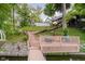 Lakeside home has backyard with stairs to wooden dock and water at 8301 Reef Ct, Indianapolis, IN 46236