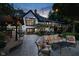 Captivating backyard patio with a cozy seating area, string lights, and access to the home at 8301 Reef Ct, Indianapolis, IN 46236