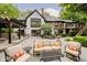 Inviting backyard patio with comfortable seating, outdoor dining area, and manicured landscaping at 8301 Reef Ct, Indianapolis, IN 46236
