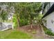 Lakeside backyard with a lake view, dock access, and a paved walkway at 8301 Reef Ct, Indianapolis, IN 46236