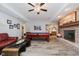 Basement Gathering room featuring a pool table, leather sofa, and fireplace at 8301 Reef Ct, Indianapolis, IN 46236