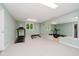 Basement gym featuring a treadmill, weight bench, a large mirror and neutral decor at 8301 Reef Ct, Indianapolis, IN 46236