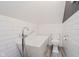 Attic bathroom showcasing a freestanding tub, toilet, wood look floors, and white subway tile at 8301 Reef Ct, Indianapolis, IN 46236