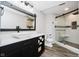 Modern bathroom featuring a glass shower, granite countertops, and stylish vanity at 8301 Reef Ct, Indianapolis, IN 46236