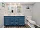 Bathroom featuring double sink vanity, with modern vessel sinks and a blue painted cabinet at 8301 Reef Ct, Indianapolis, IN 46236