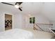 Finished attic bedroom with a ceiling fan, dormer window, carpet and neutral paint at 8301 Reef Ct, Indianapolis, IN 46236