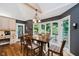 Spacious eat-in kitchen and dining space with hardwood floors, natural lighting, and a view to the outdoors at 8301 Reef Ct, Indianapolis, IN 46236