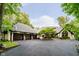 Impressive exterior with a spacious driveway, three-car garage, and meticulously landscaped front yard at 8301 Reef Ct, Indianapolis, IN 46236