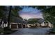 Charming curb appeal with a circular driveway, well-maintained lawn, and attached three-car garage at 8301 Reef Ct, Indianapolis, IN 46236