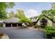 Elegant home showcasing a spacious driveway, attached three-car garage, and manicured front yard at 8301 Reef Ct, Indianapolis, IN 46236