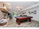 Finished basement featuring a pool table, fireplace, and sliding glass doors at 8301 Reef Ct, Indianapolis, IN 46236