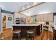 Updated eat-in kitchen features a large island with seating, light-colored cabinets, and stainless steel appliances at 8301 Reef Ct, Indianapolis, IN 46236