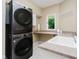 Well-equipped laundry room featuring modern appliances, ample counter space, and convenient storage solutions at 8301 Reef Ct, Indianapolis, IN 46236