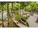 Expansive outdoor space features a covered patio, dining, and outdoor kitchen with stunning views of the lake at 8301 Reef Ct, Indianapolis, IN 46236