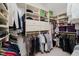 Spacious walk-in closet with custom shelving, hanging racks, and ample storage space at 8301 Reef Ct, Indianapolis, IN 46236