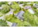 Aerial view of the home, trees and backyard pool in the neighborhood at 9010 Deer Run Dr, Indianapolis, IN 46256