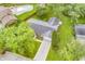 Aerial view of the home with a long driveway, landscaping and a backyard pool at 9010 Deer Run Dr, Indianapolis, IN 46256