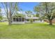 Back of house featuring an enclosed screened in porch at 9010 Deer Run Dr, Indianapolis, IN 46256