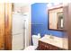 Bathroom with granite vanity, shower and blue accent wall at 9010 Deer Run Dr, Indianapolis, IN 46256