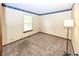 Bedroom with carpet flooring, neutral paint and natural lighting at 9010 Deer Run Dr, Indianapolis, IN 46256