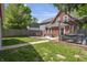 Inviting backyard featuring a fire pit, deck, and well-maintained lawn, perfect for outdoor entertaining and relaxation at 941 N Beville Ave, Indianapolis, IN 46201