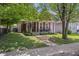 Quaint two-story home with a welcoming front porch, perfect for relaxing outdoors at 941 N Beville Ave, Indianapolis, IN 46201