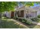 Inviting two-story home featuring a classic front porch with rocking chairs and curb appeal at 941 N Beville Ave, Indianapolis, IN 46201