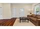 Warm and inviting living room with hardwood floors and a cozy seating arrangement at 941 N Beville Ave, Indianapolis, IN 46201