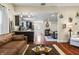 Open-concept living room with hardwood floors and modern kitchen in background at 941 N Beville Ave, Indianapolis, IN 46201