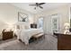 Spacious bedroom features soft lighting, plush carpet, modern decor, and bright, airy windows at 941 N Beville Ave, Indianapolis, IN 46201