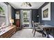 Well-lit office space featuring a window, neutral colored carpet, and decoratively staged desk at 941 N Beville Ave, Indianapolis, IN 46201