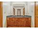 Dual sink bathroom vanity with classic wood cabinetry, perfect for a shared space with ample room at 959 Harvest Ridge Dr, Avon, IN 46123